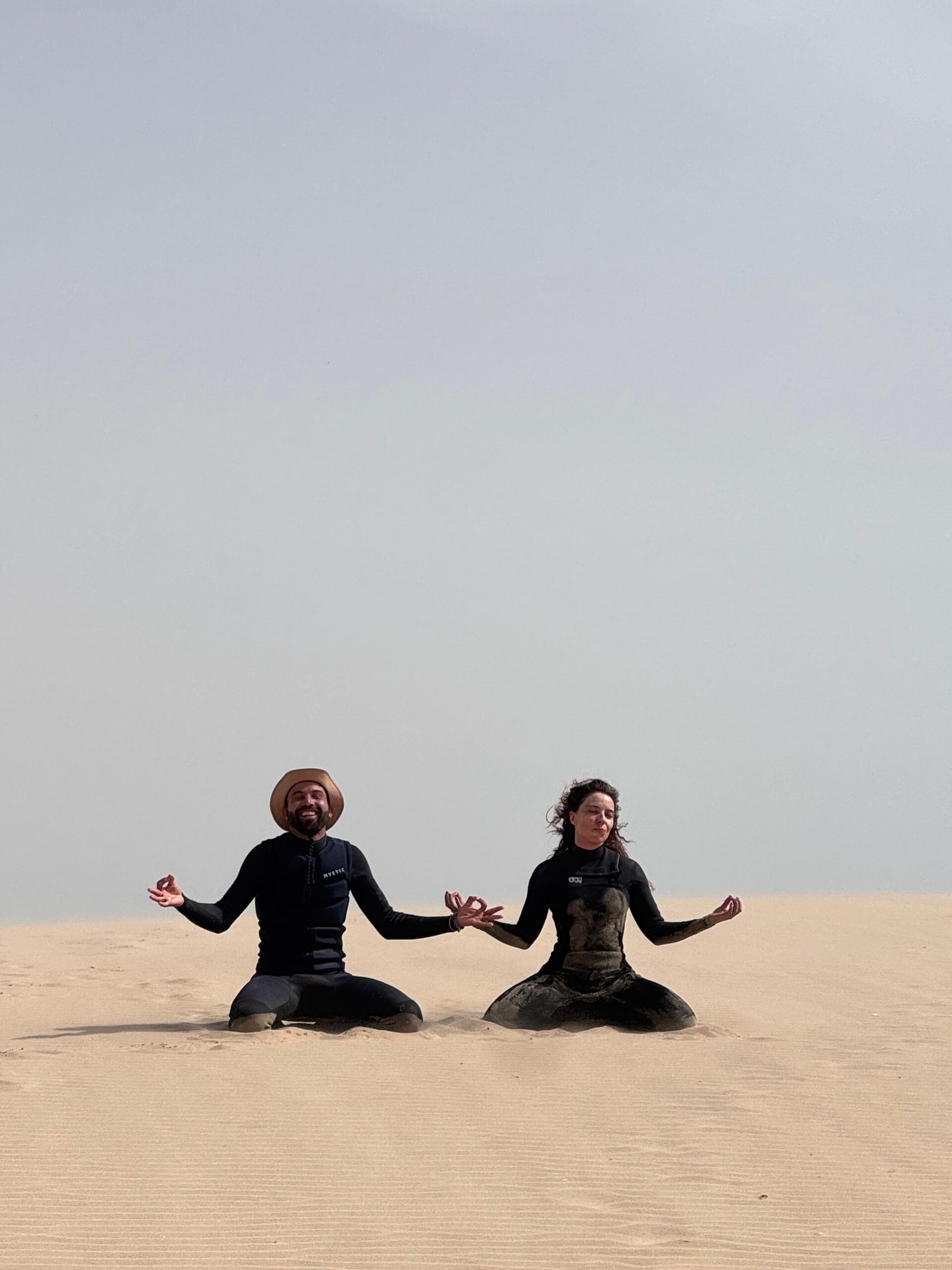 Two kitesurfers relaxing on the beach in Dakhla